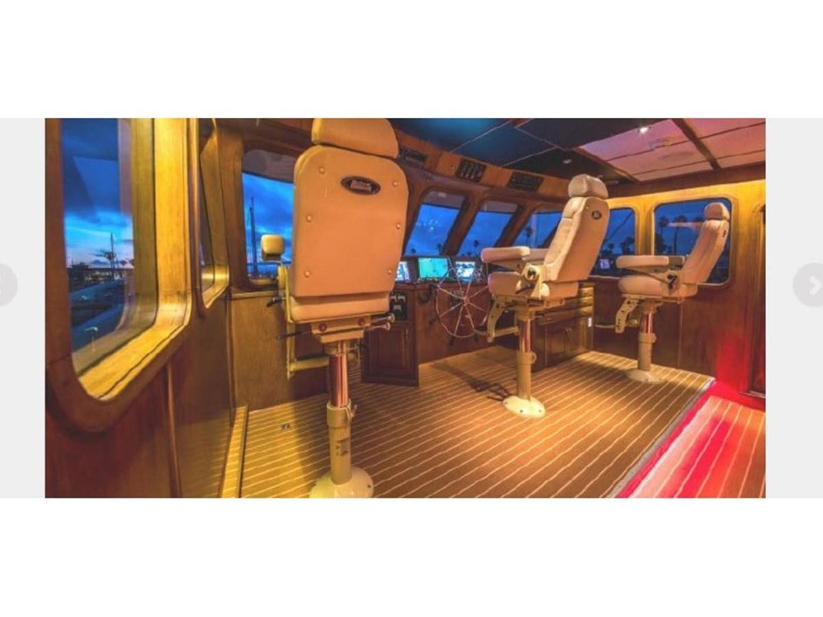 a train with a large orange interior aboard BEAR PAW Yacht for Sale