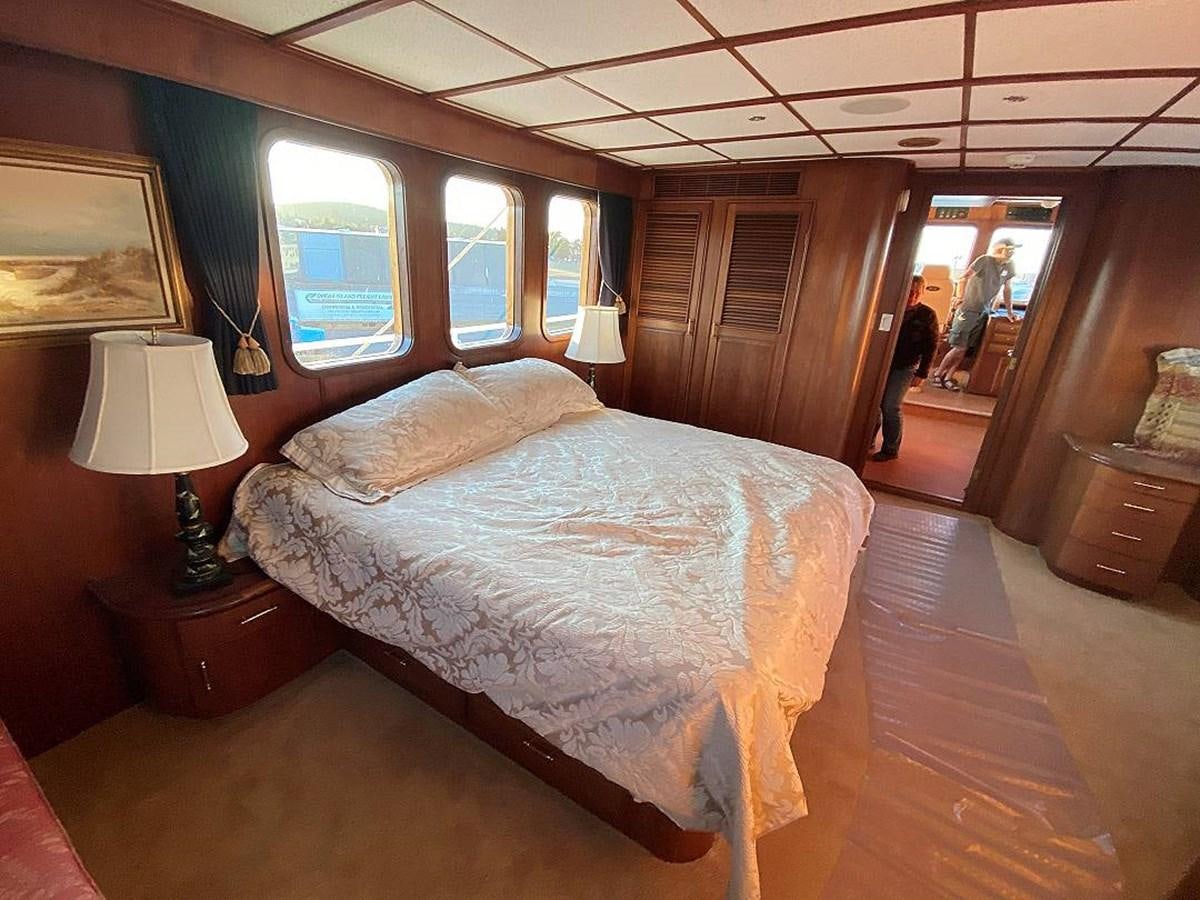 a bed in a room aboard BEAR PAW Yacht for Sale