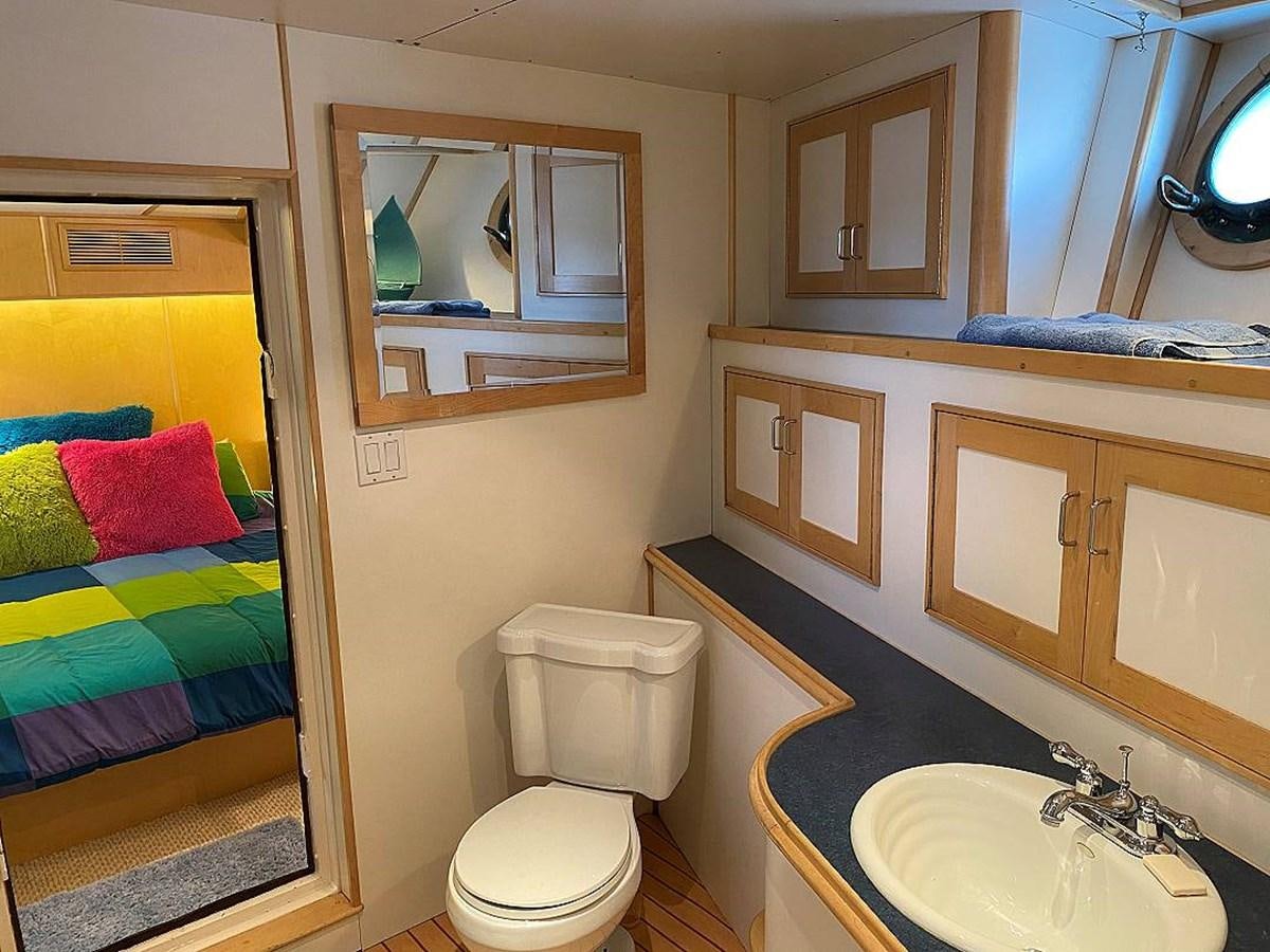 a bathroom with a toilet and a sink aboard BEAR PAW Yacht for Sale