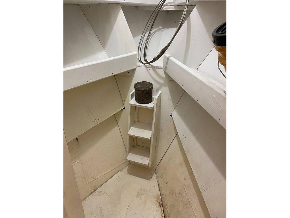 a small room with a shelf and a shelf with a wire aboard BEAR PAW Yacht for Sale