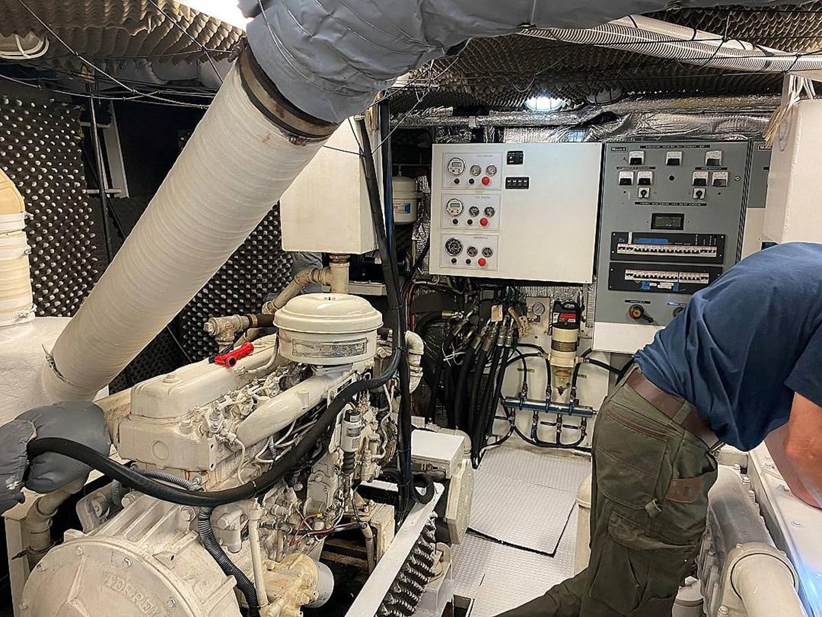 a person working in a factory aboard BEAR PAW Yacht for Sale