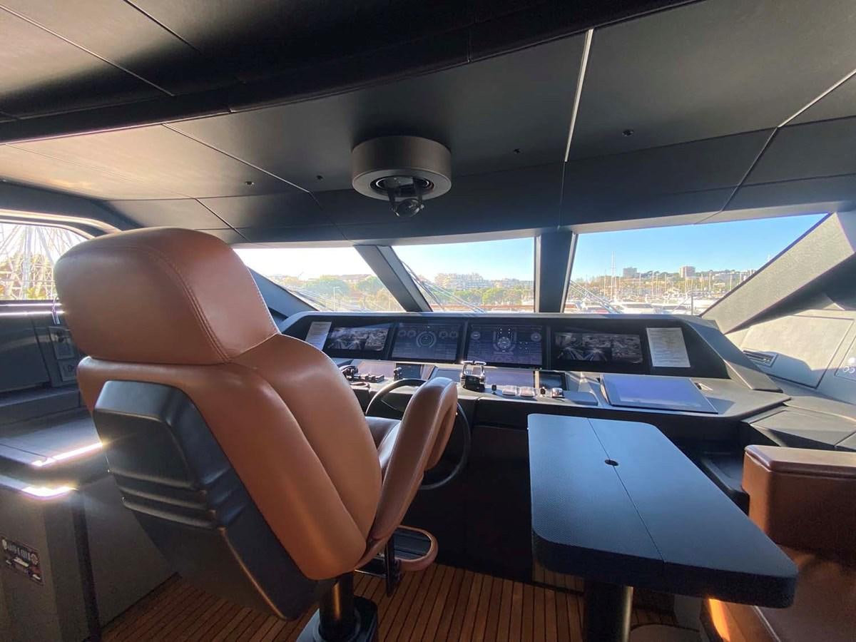 a person sitting in a plane aboard AMORES Yacht for Sale