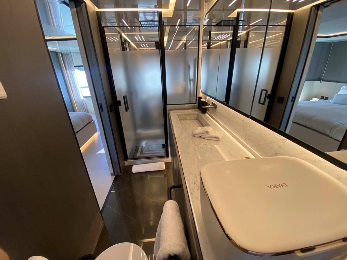 a bathroom with a large mirror aboard AMORES Yacht for Sale