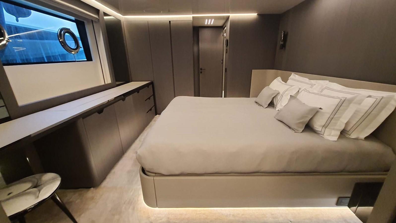 a bed in a room aboard AMORES Yacht for Sale
