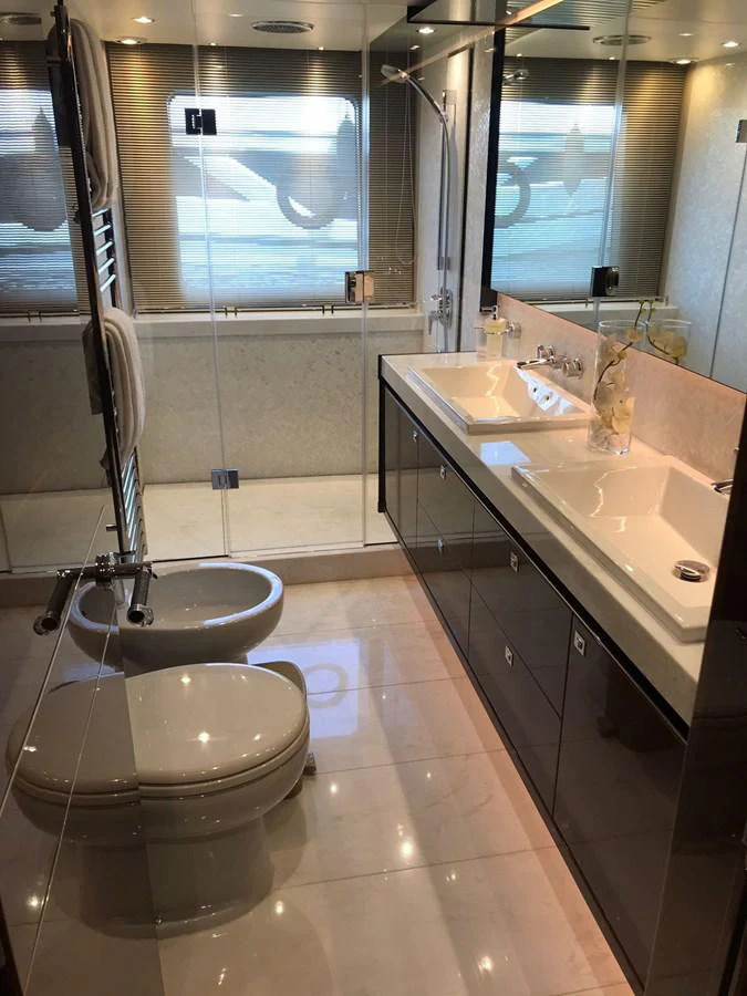 a bathroom with a large mirror aboard ANIKO Yacht for Sale