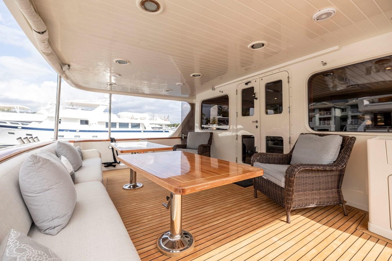 a boat with a table and chairs aboard ANNIE Yacht for Sale