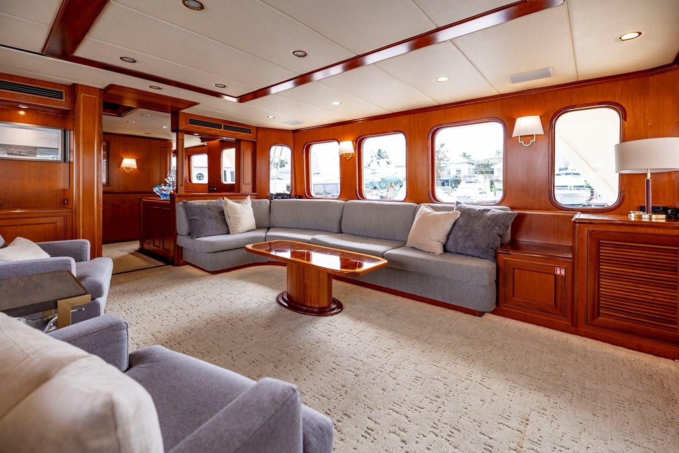 a living room with a couch and a coffee table aboard ANNIE Yacht for Sale