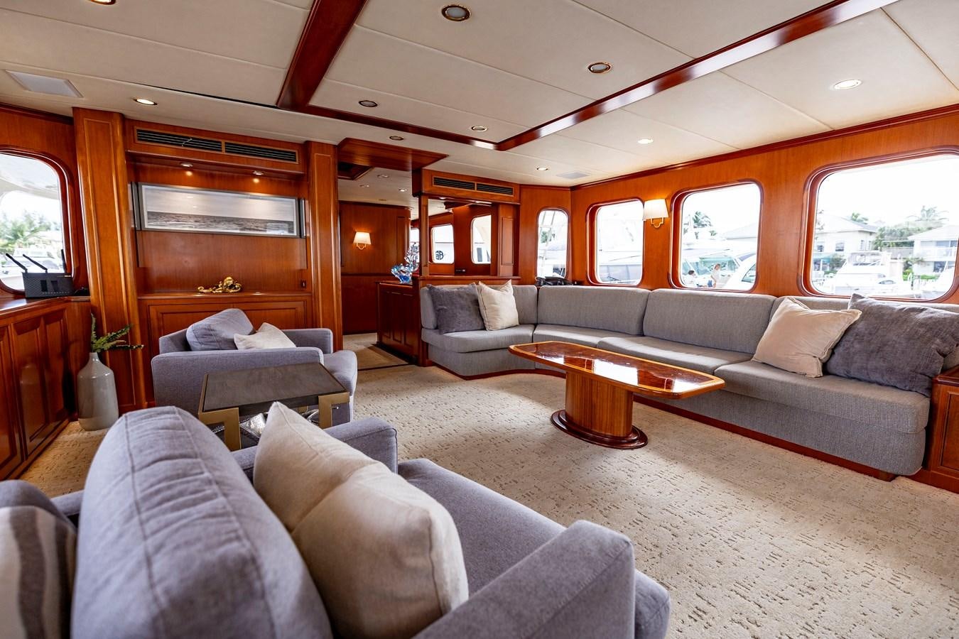 a living room with a couch and a coffee table aboard ANNIE Yacht for Sale
