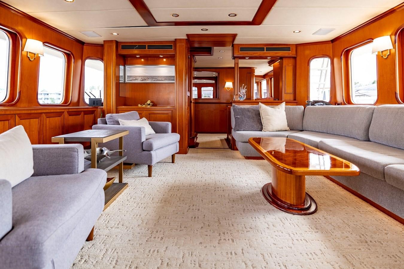 a living room with a couch and a coffee table aboard ANNIE Yacht for Sale