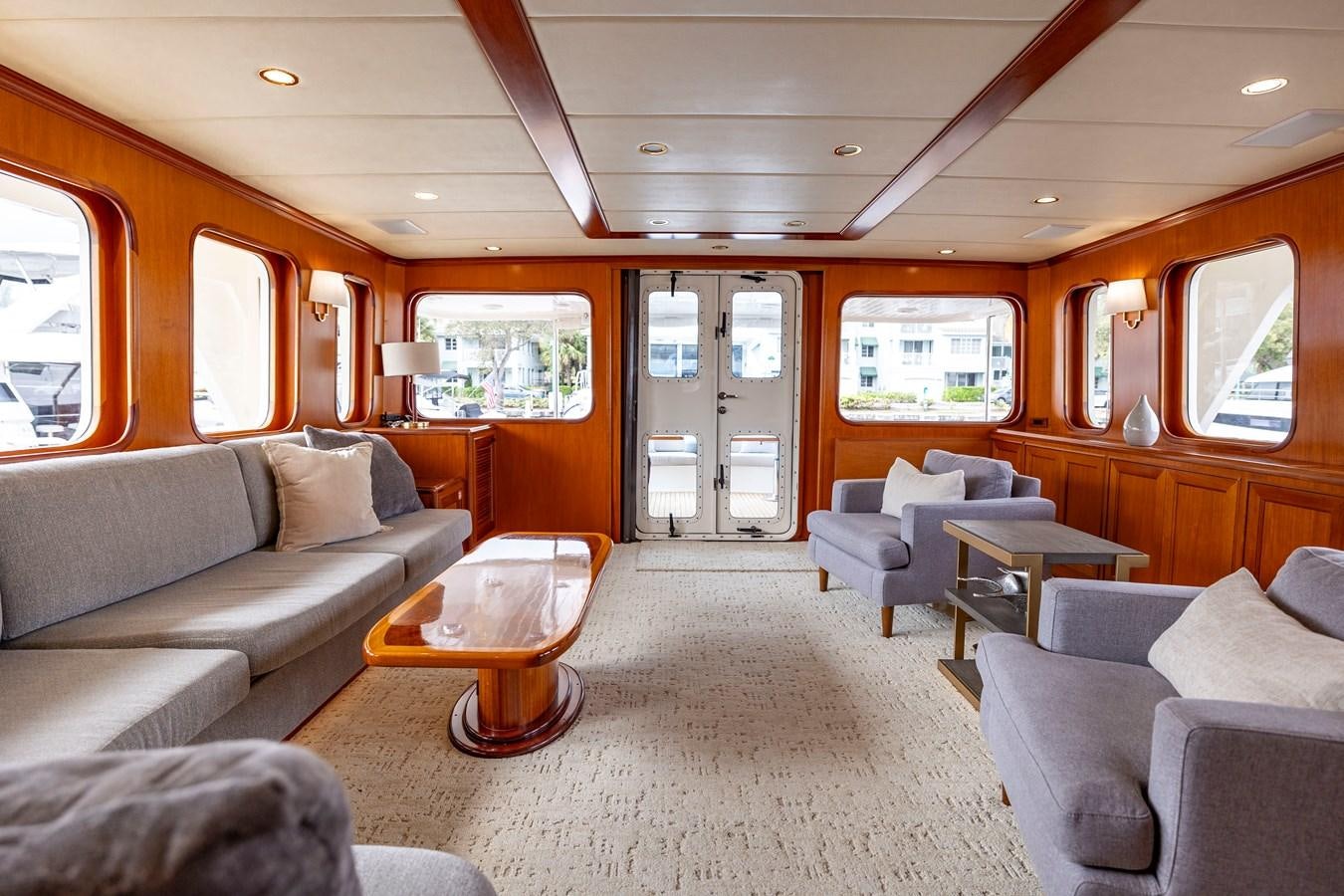 a train car with a couch and chairs aboard ANNIE Yacht for Sale