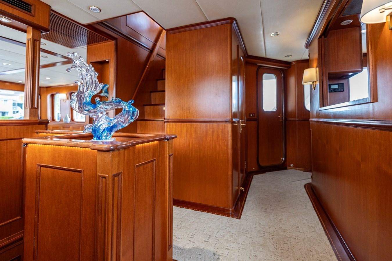 a kitchen with wooden cabinets aboard ANNIE Yacht for Sale