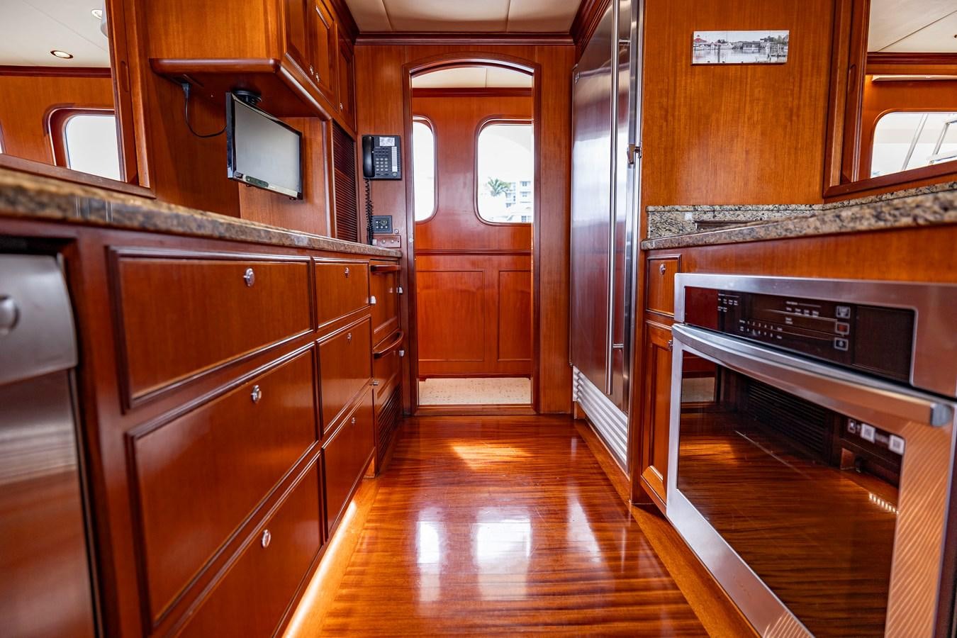 a kitchen with wooden cabinets aboard ANNIE Yacht for Sale