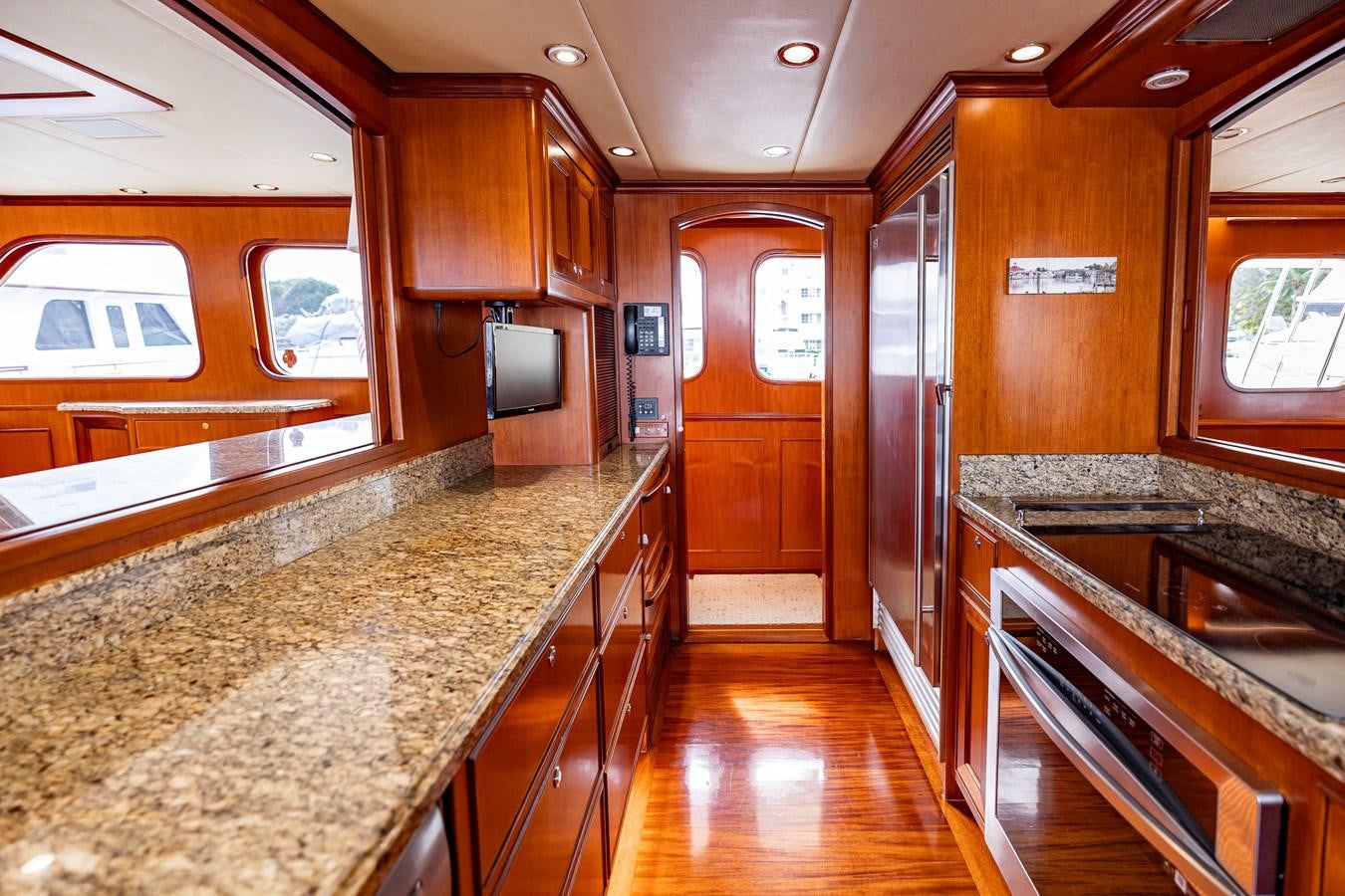 a kitchen with a countertop sink and cabinets aboard ANNIE Yacht for Sale