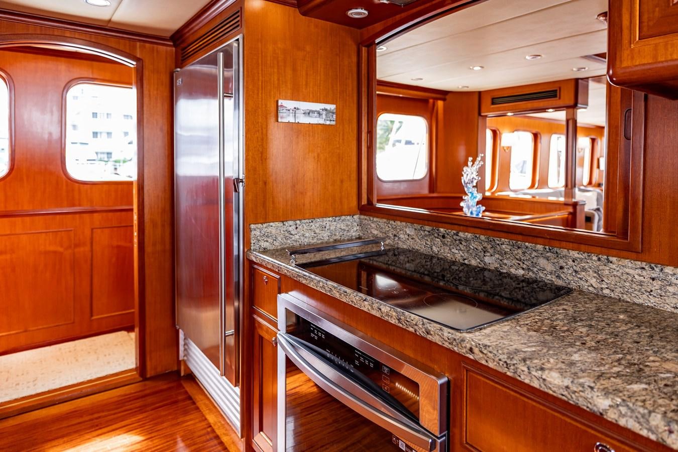a kitchen with marble counters aboard ANNIE Yacht for Sale