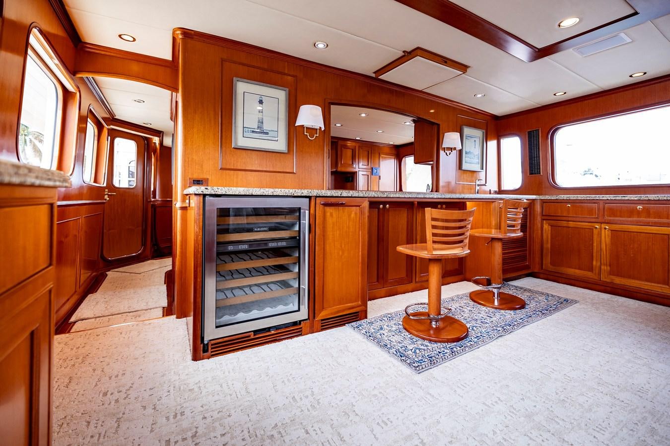 a large kitchen with a fireplace aboard ANNIE Yacht for Sale