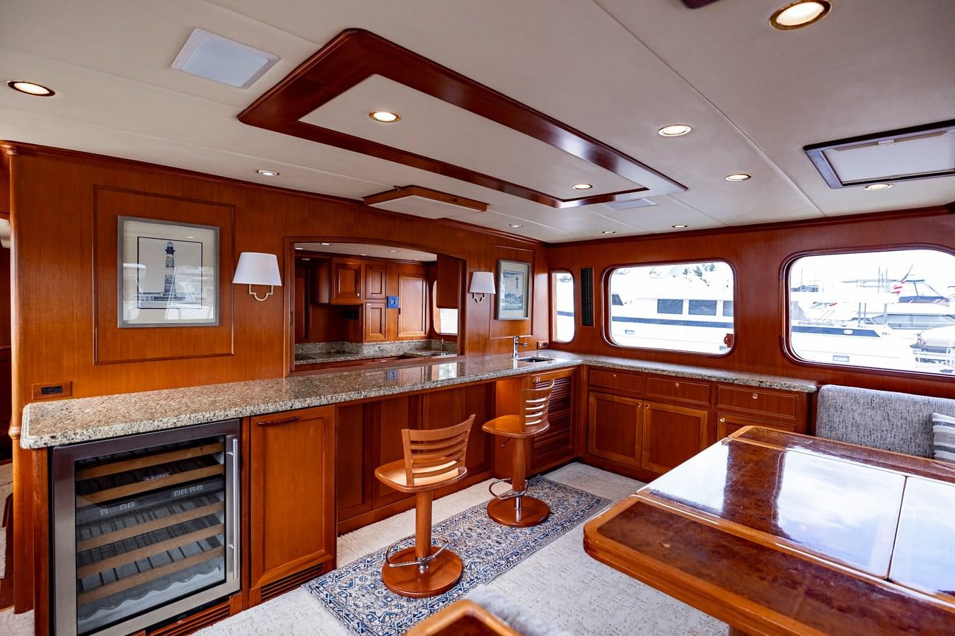 a large kitchen with wooden cabinets aboard ANNIE Yacht for Sale