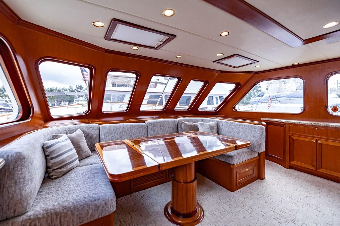 a living room with a couch and a coffee table aboard ANNIE Yacht for Sale