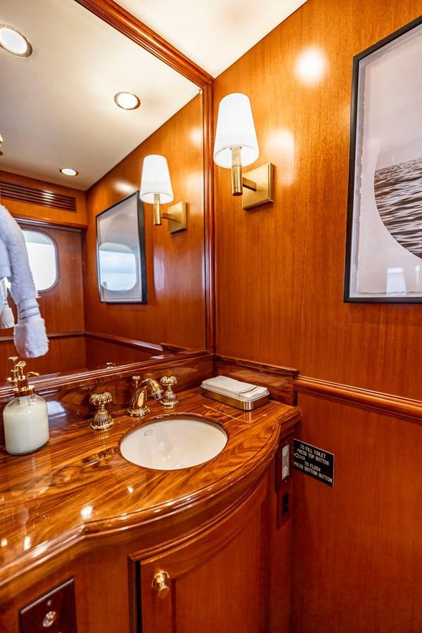 a bathroom with a sink and a mirror aboard ANNIE Yacht for Sale