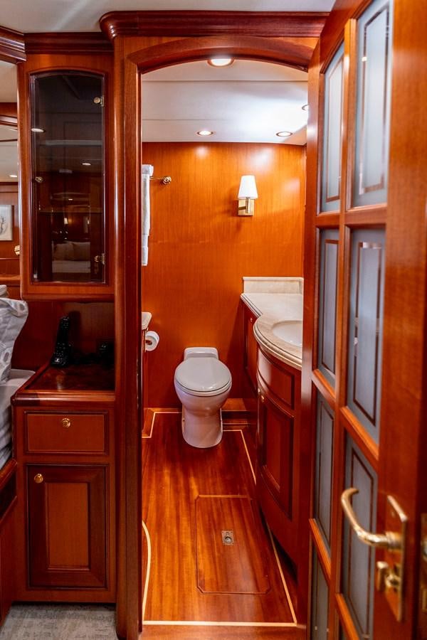 a bathroom with a toilet and a sink aboard ANNIE Yacht for Sale