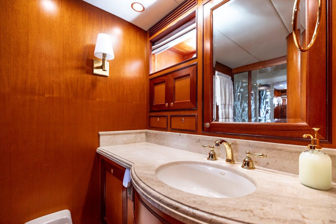 a bathroom with a large mirror aboard ANNIE Yacht for Sale