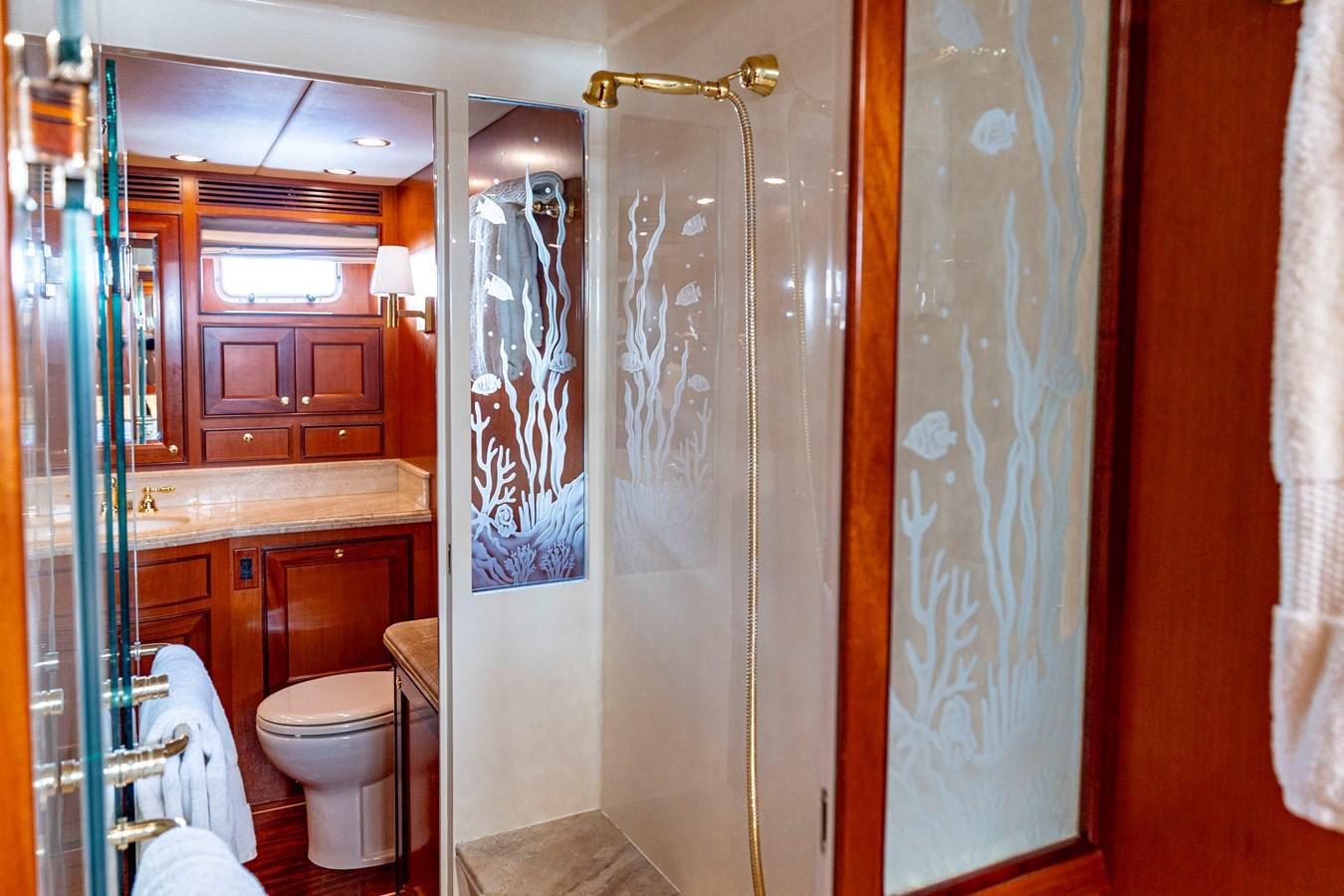 a bathroom with a shower and toilet aboard ANNIE Yacht for Sale