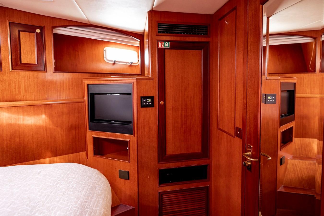 a room with wooden cabinets aboard ANNIE Yacht for Sale