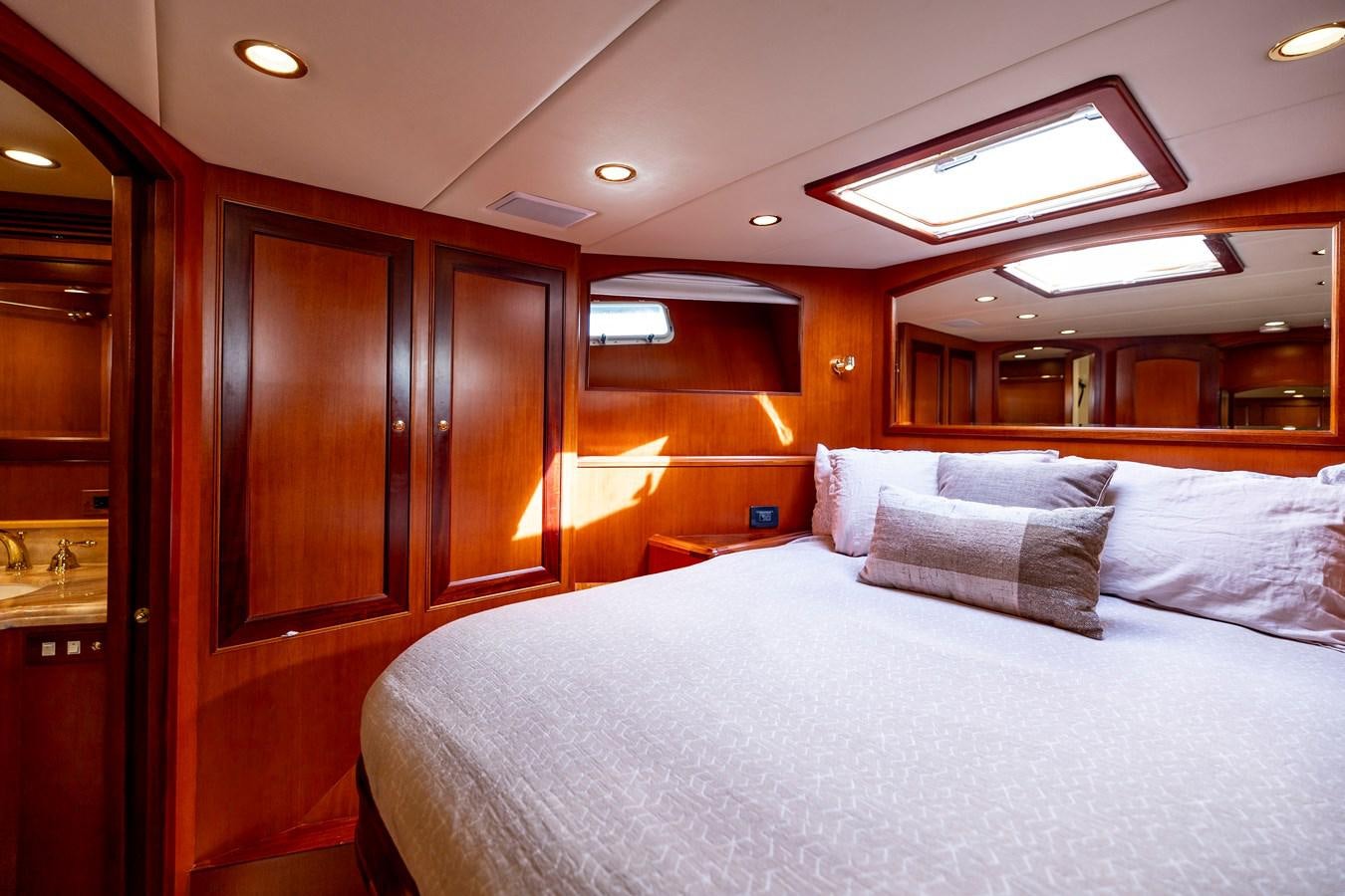 a bed in a room aboard ANNIE Yacht for Sale