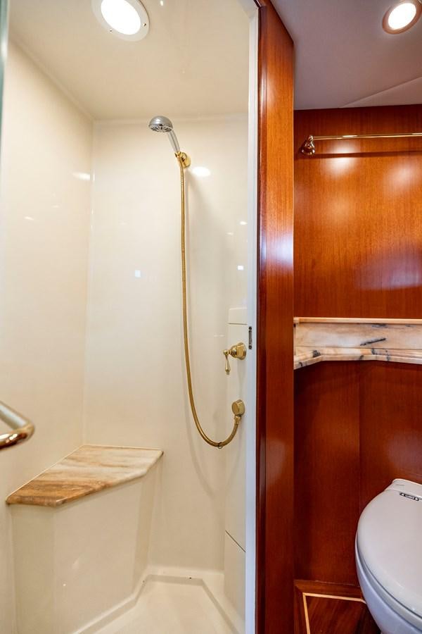 a bathroom with a shower and a toilet aboard ANNIE Yacht for Sale