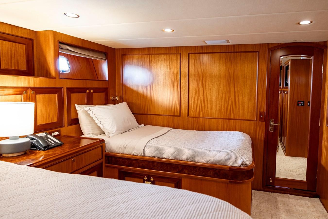 a hotel room with two beds aboard ANNIE Yacht for Sale