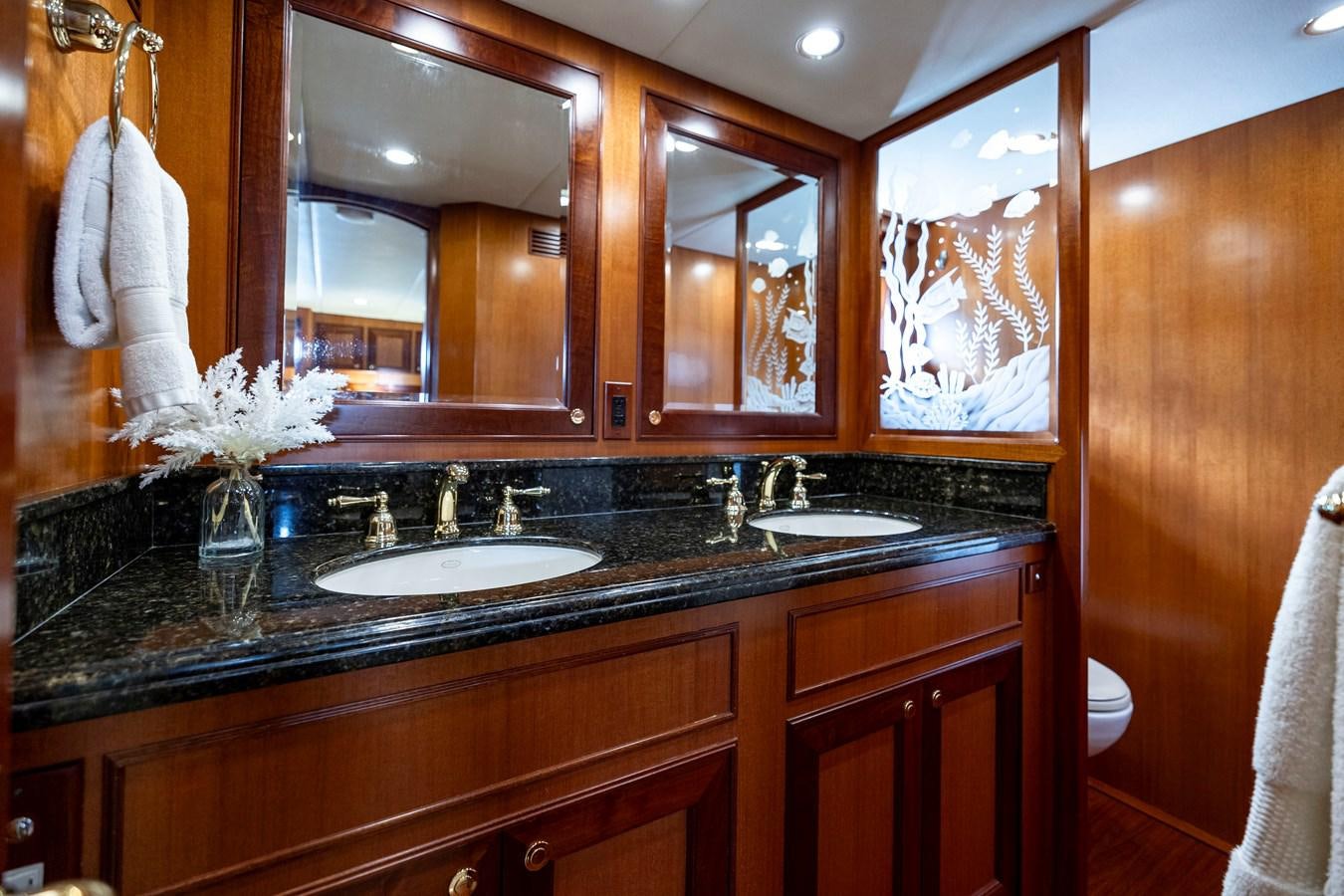 a bathroom with a large mirror aboard ANNIE Yacht for Sale