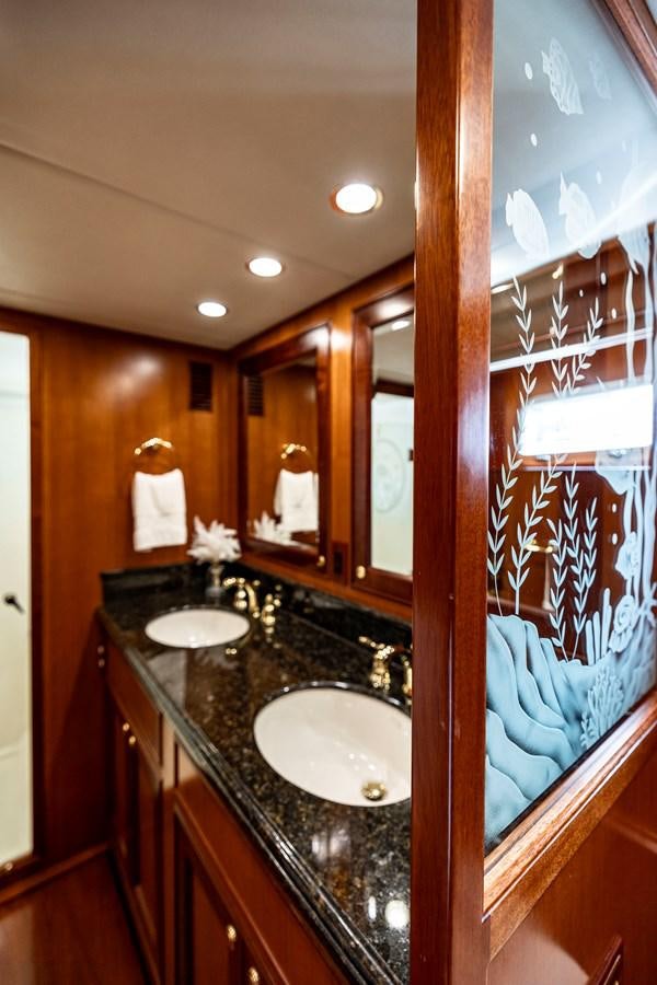 a bathroom with a large mirror aboard ANNIE Yacht for Sale