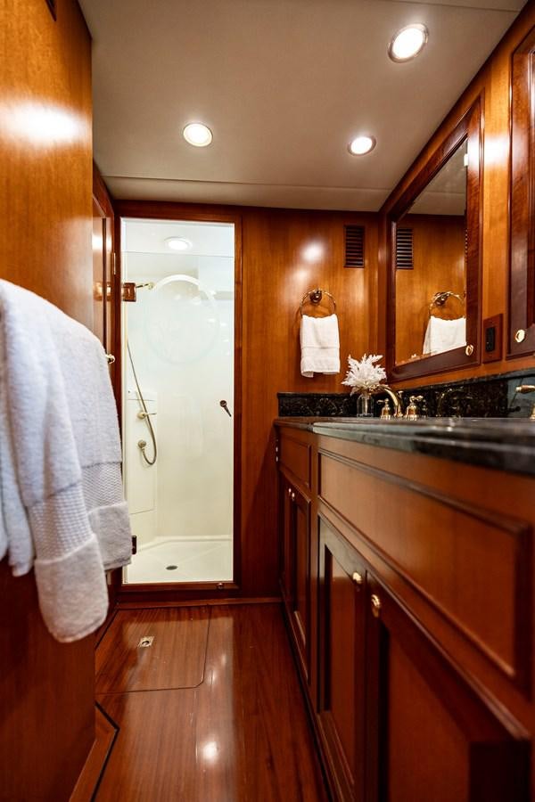 a kitchen with wooden cabinets aboard ANNIE Yacht for Sale