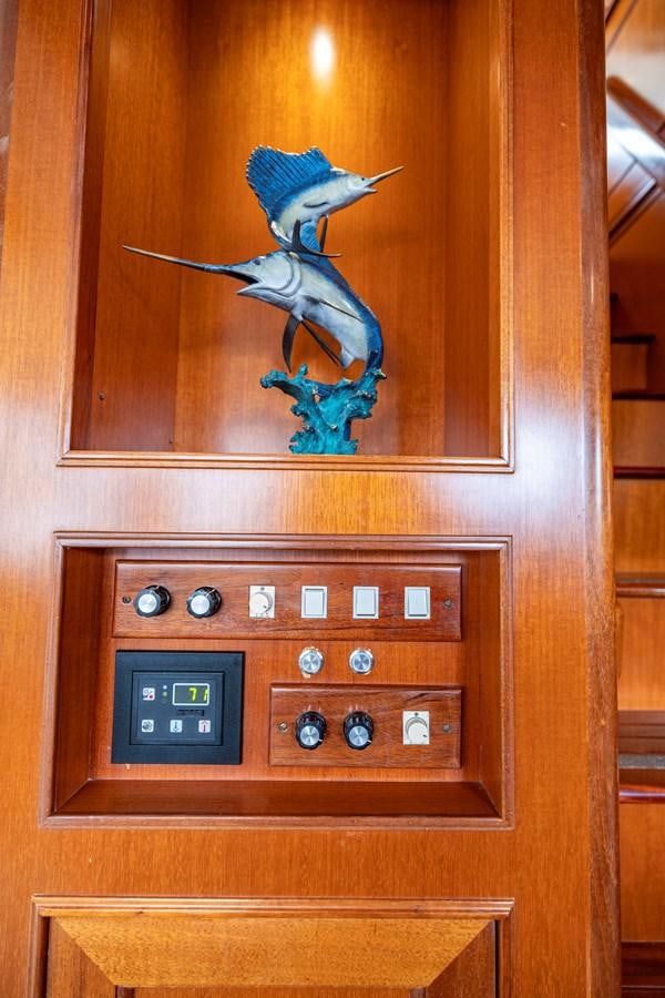 a wood cabinet with a bird on it aboard ANNIE Yacht for Sale