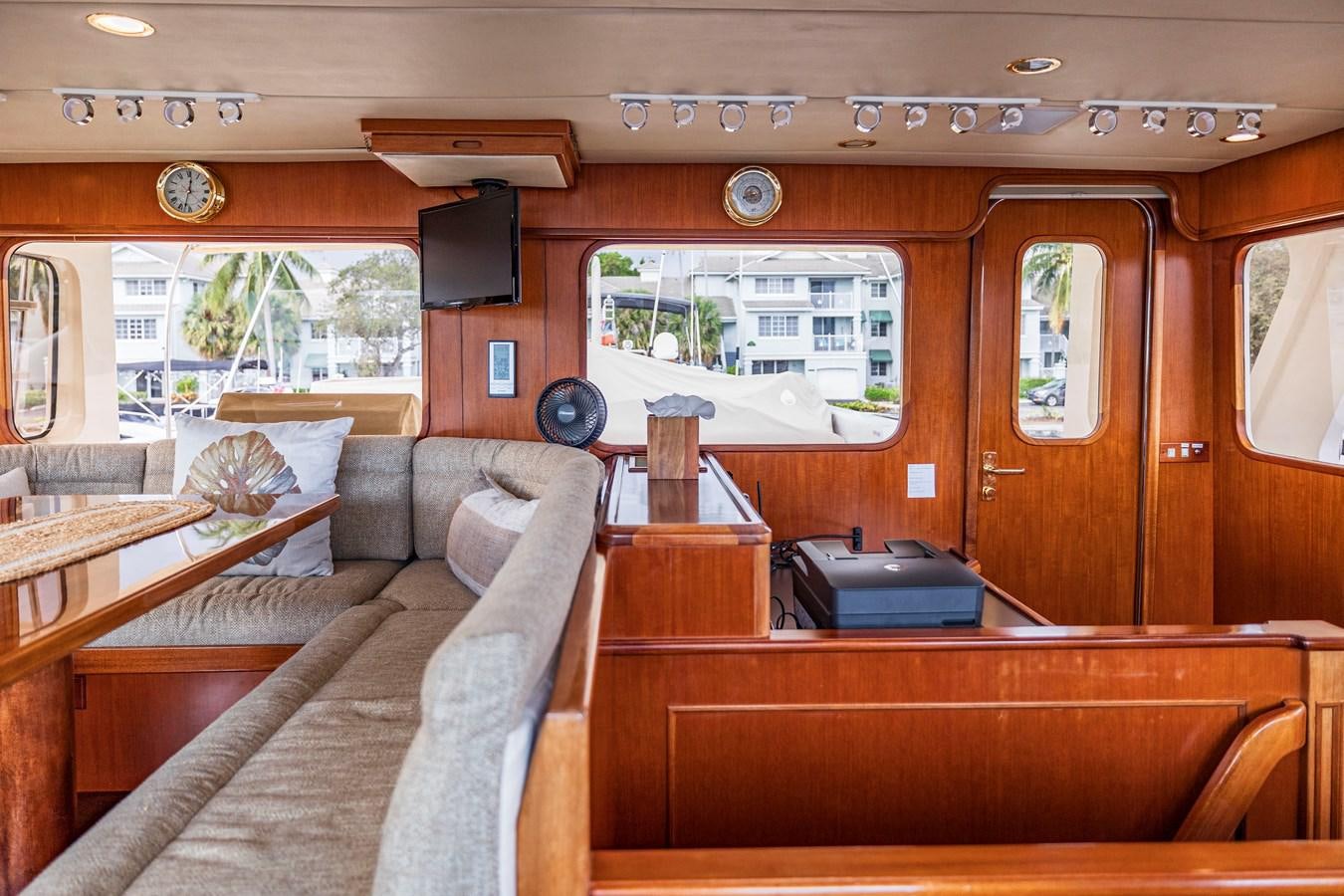 a living room with a couch and a tv aboard ANNIE Yacht for Sale