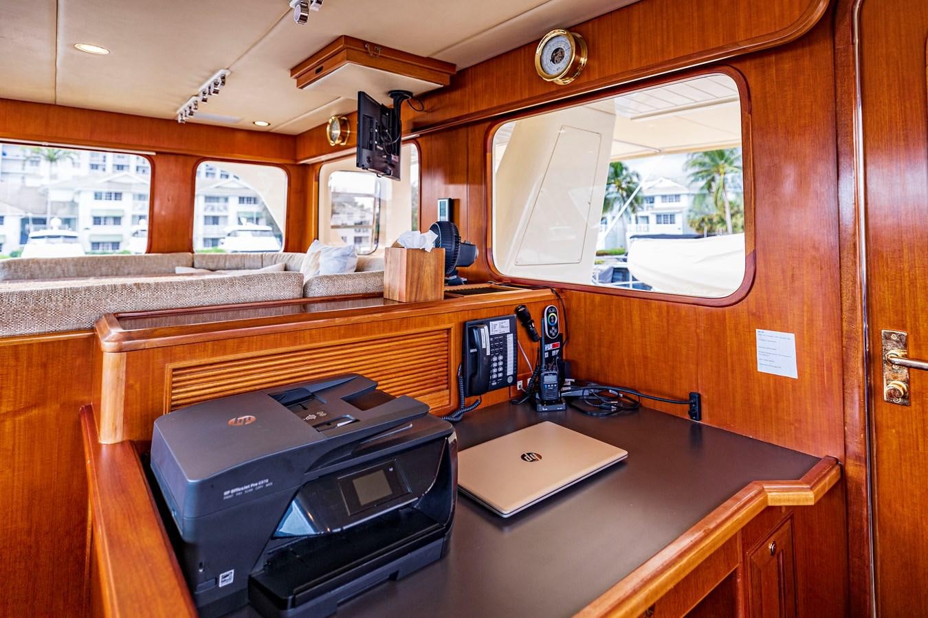 a room with a desk and computer aboard ANNIE Yacht for Sale