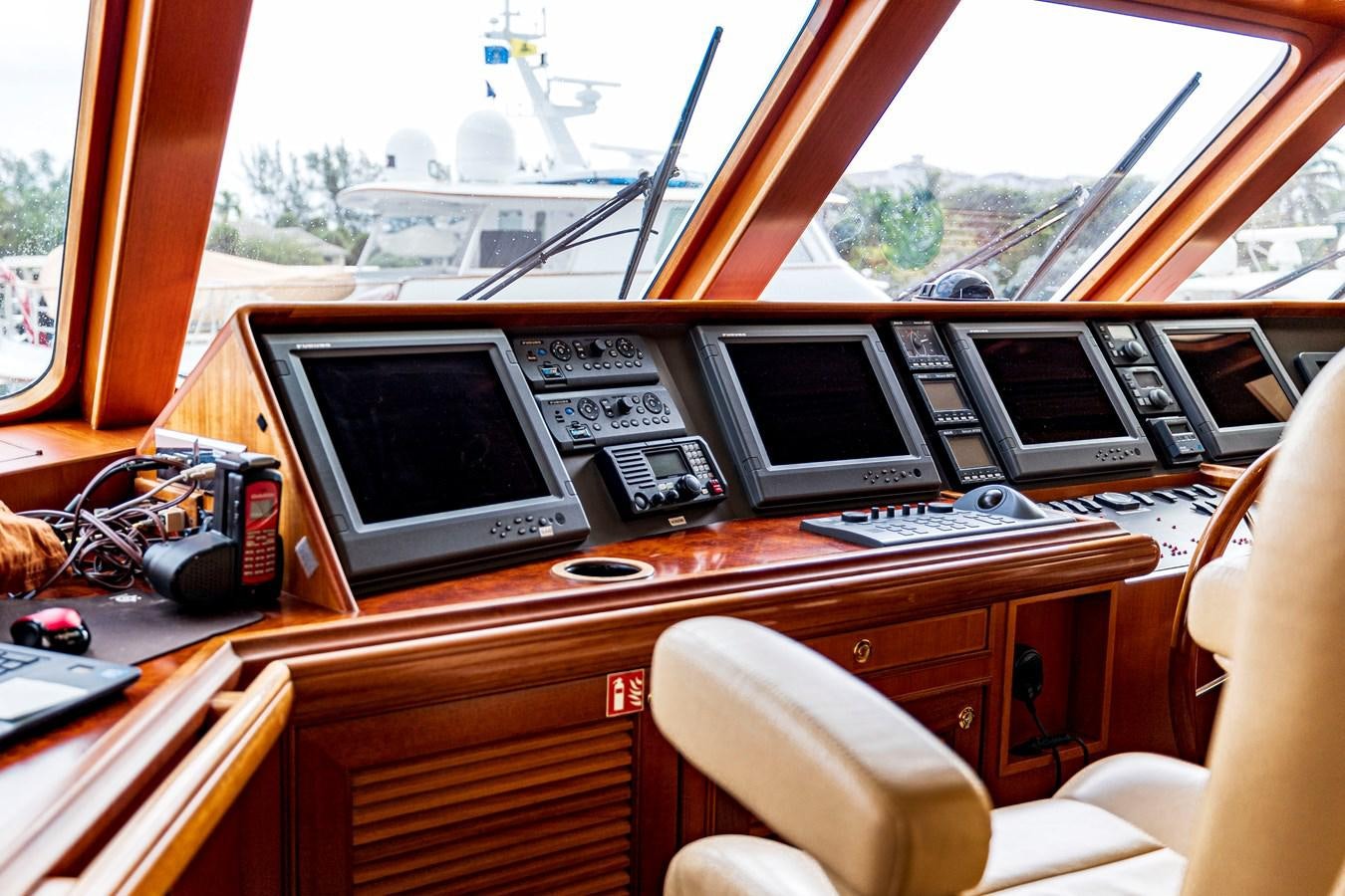 a desk with computers and other objects aboard ANNIE Yacht for Sale