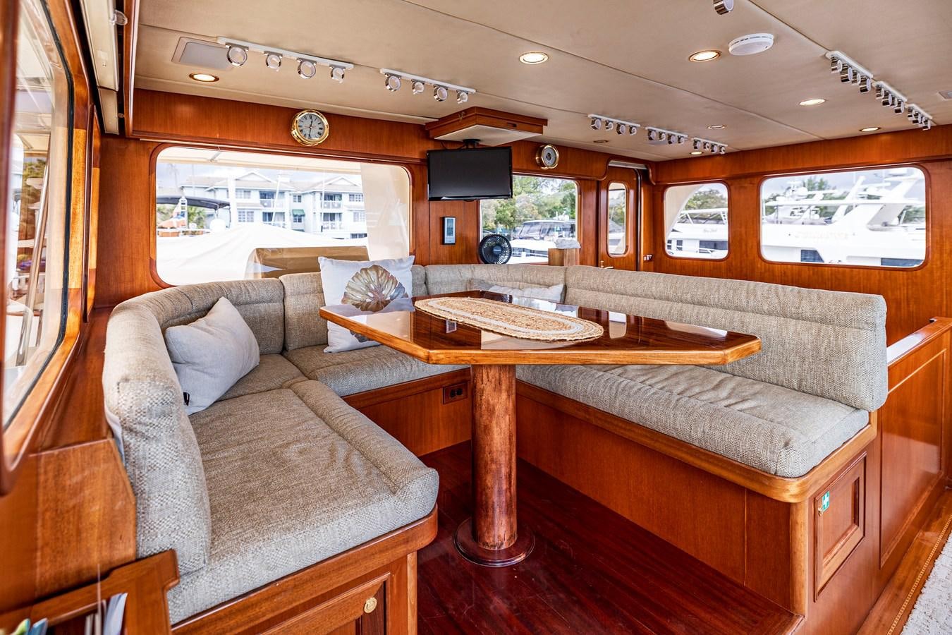 a living room with a couch and a table aboard ANNIE Yacht for Sale