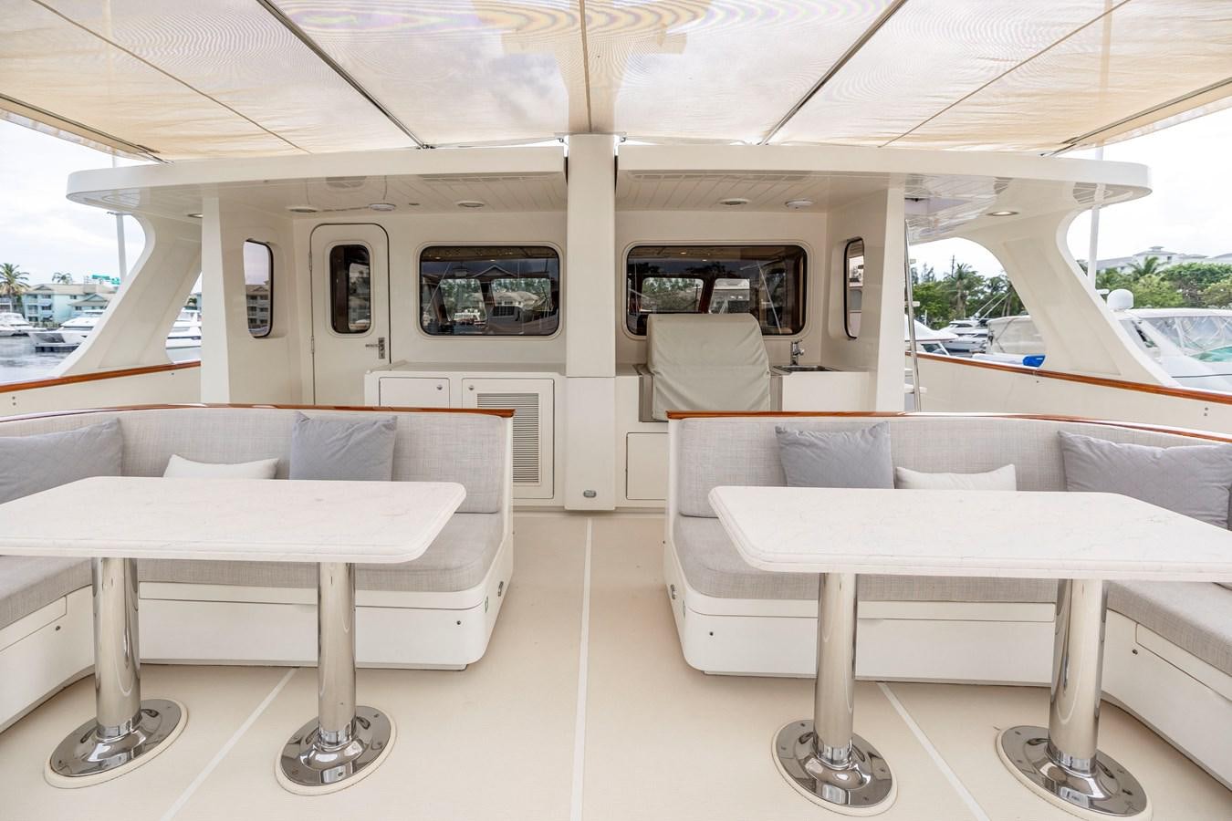 a room with a table and chairs aboard ANNIE Yacht for Sale