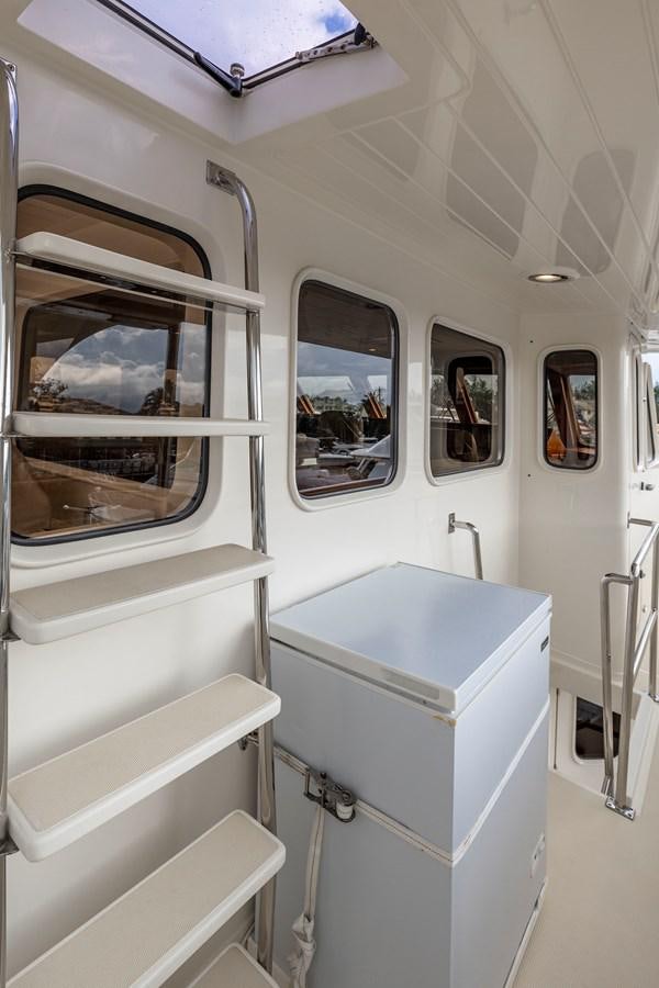 a white room with a sink and a mirror aboard ANNIE Yacht for Sale