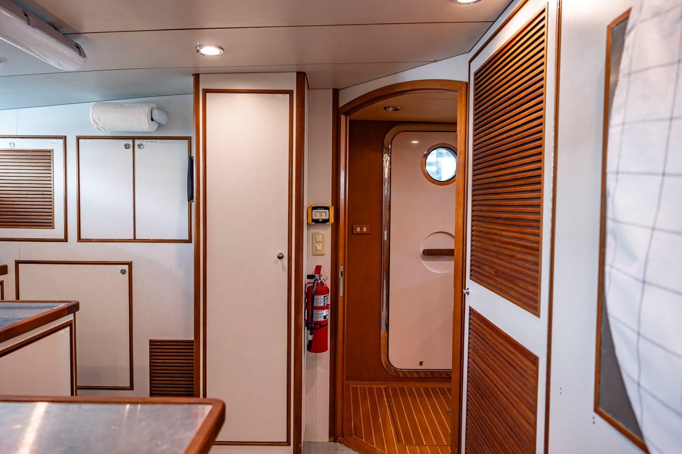 a room with a table and a door aboard ANNIE Yacht for Sale