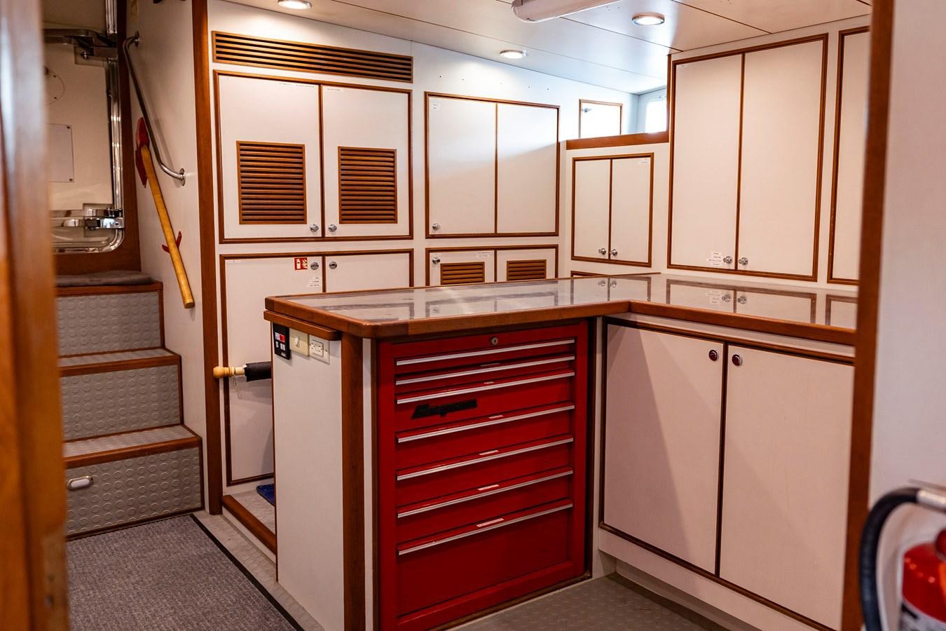 a kitchen with white cabinets aboard ANNIE Yacht for Sale