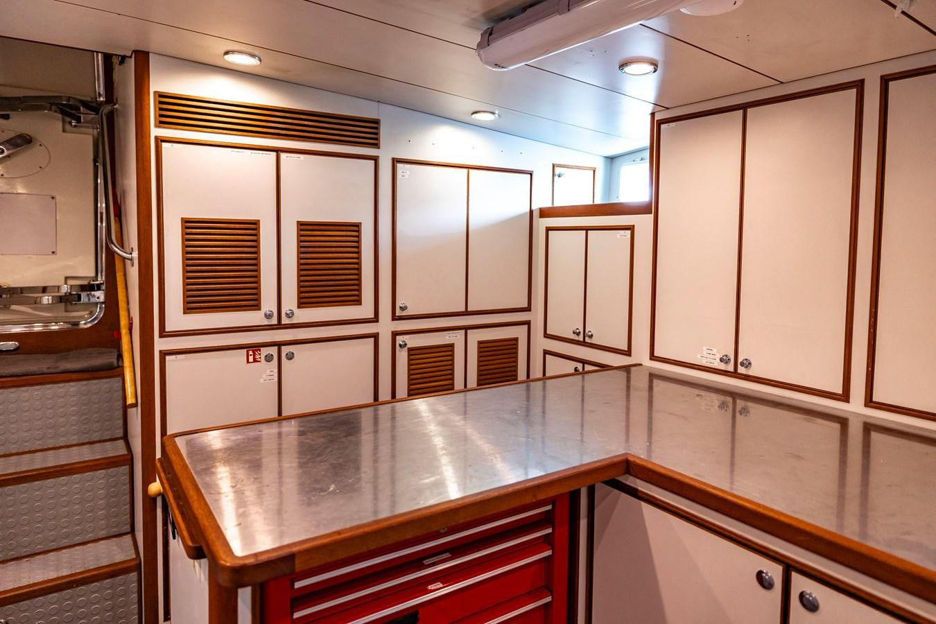 a kitchen with cabinets and a counter aboard ANNIE Yacht for Sale