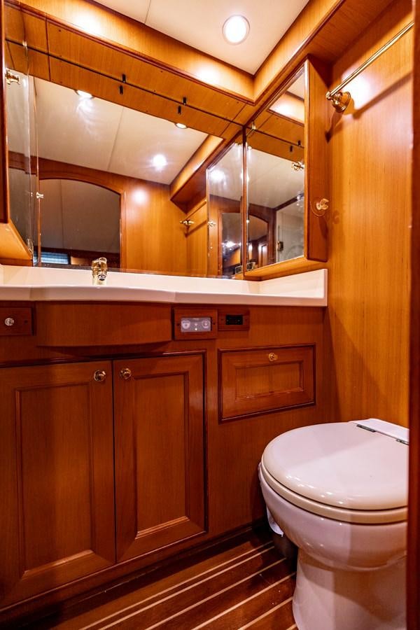 a bathroom with a toilet and a sink aboard ANNIE Yacht for Sale