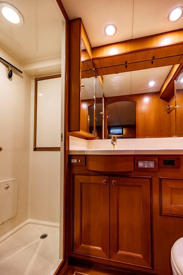 a bathroom with a sink and cabinets aboard ANNIE Yacht for Sale