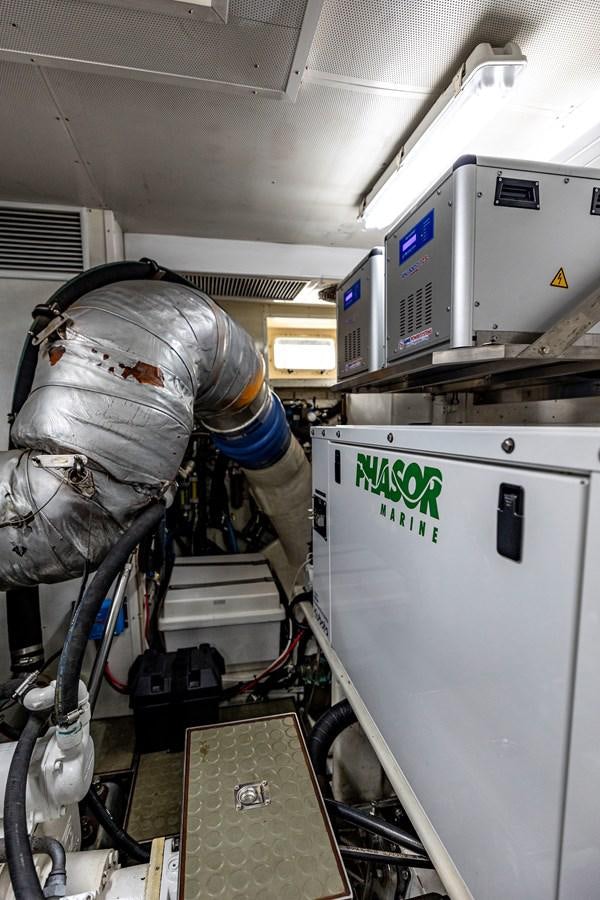 a person in a space suit working on a computer aboard ANNIE Yacht for Sale