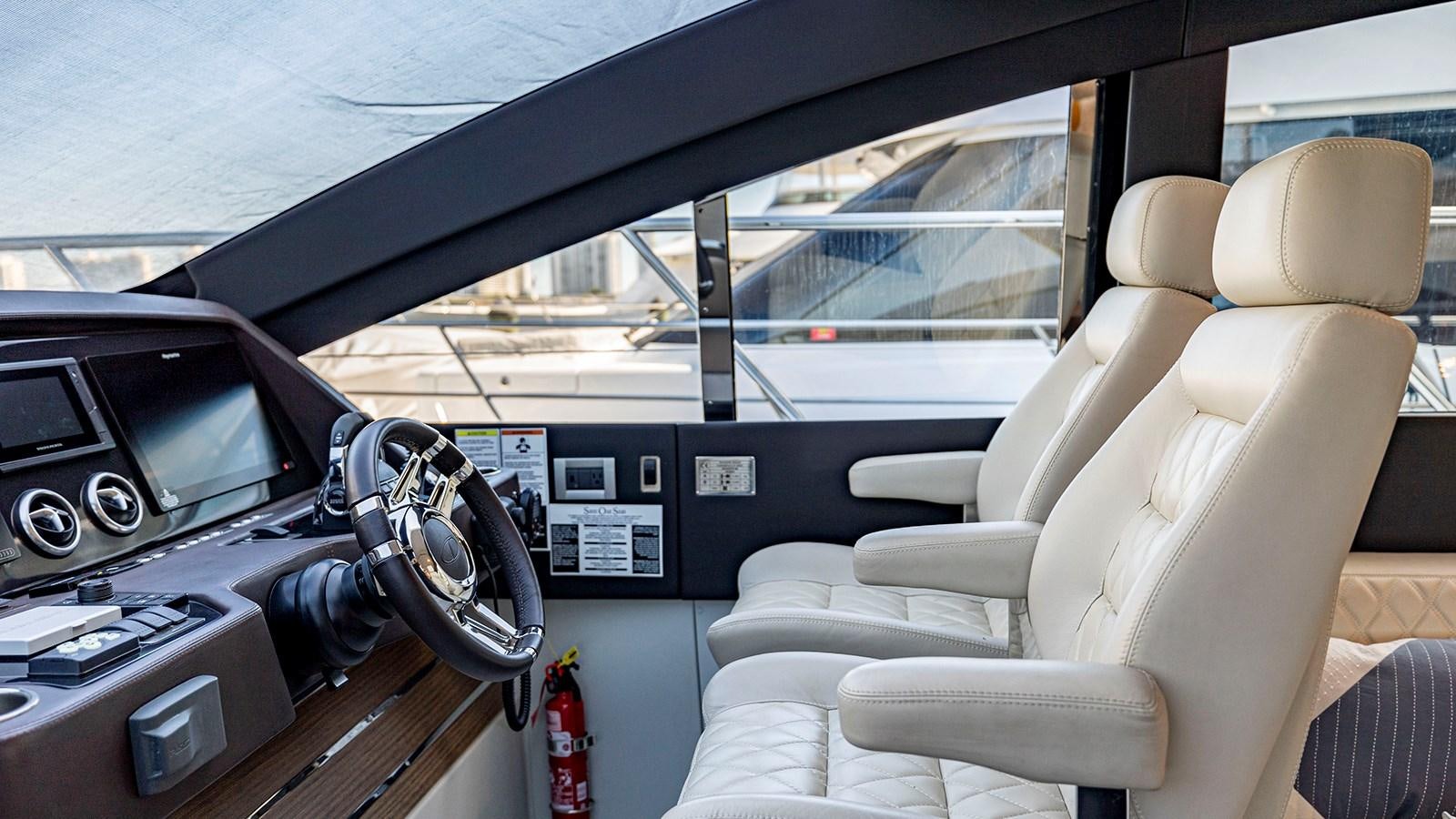 inside of a car aboard MON TON Yacht for Sale