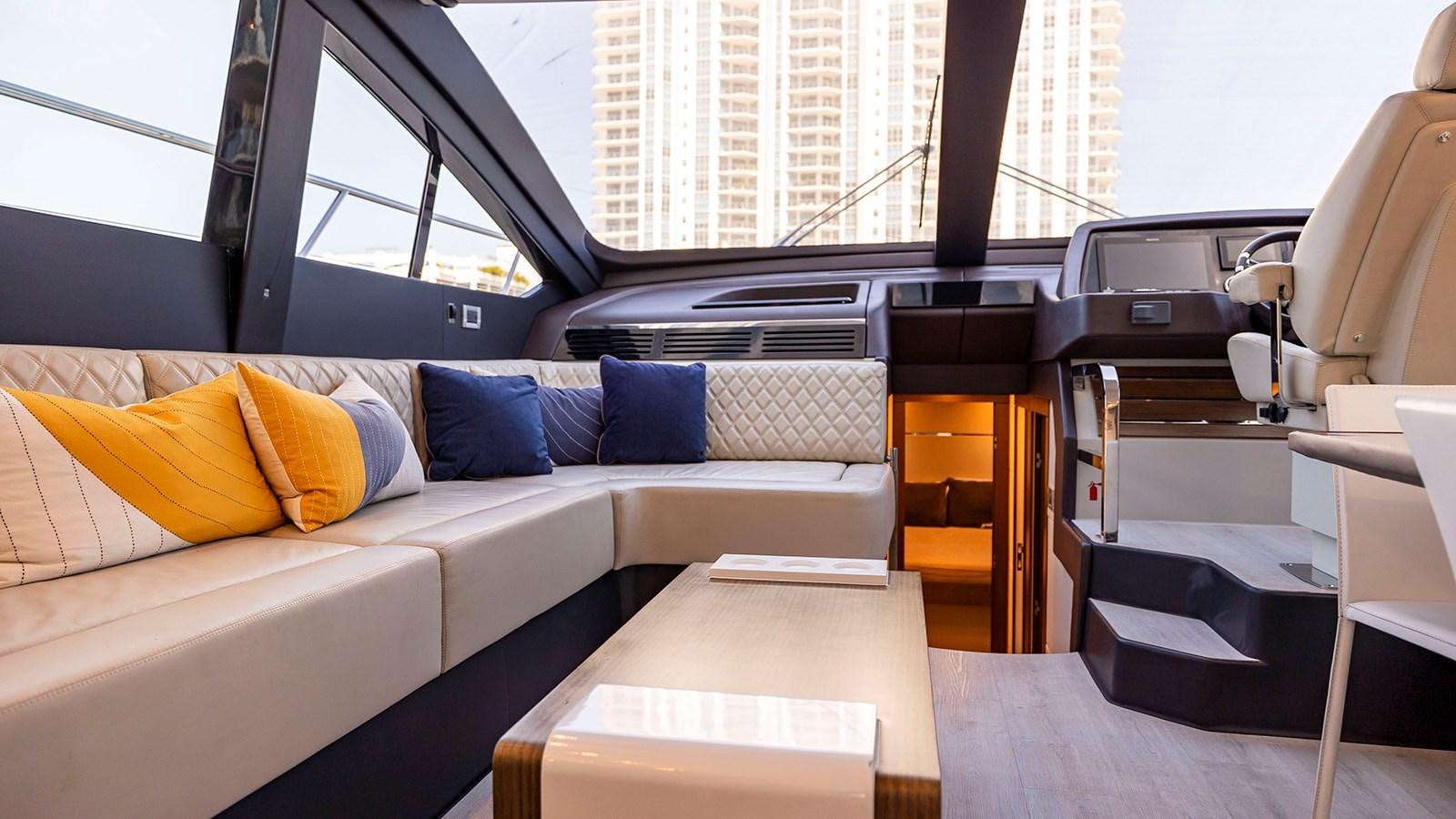 a couch in a room aboard MON TON Yacht for Sale