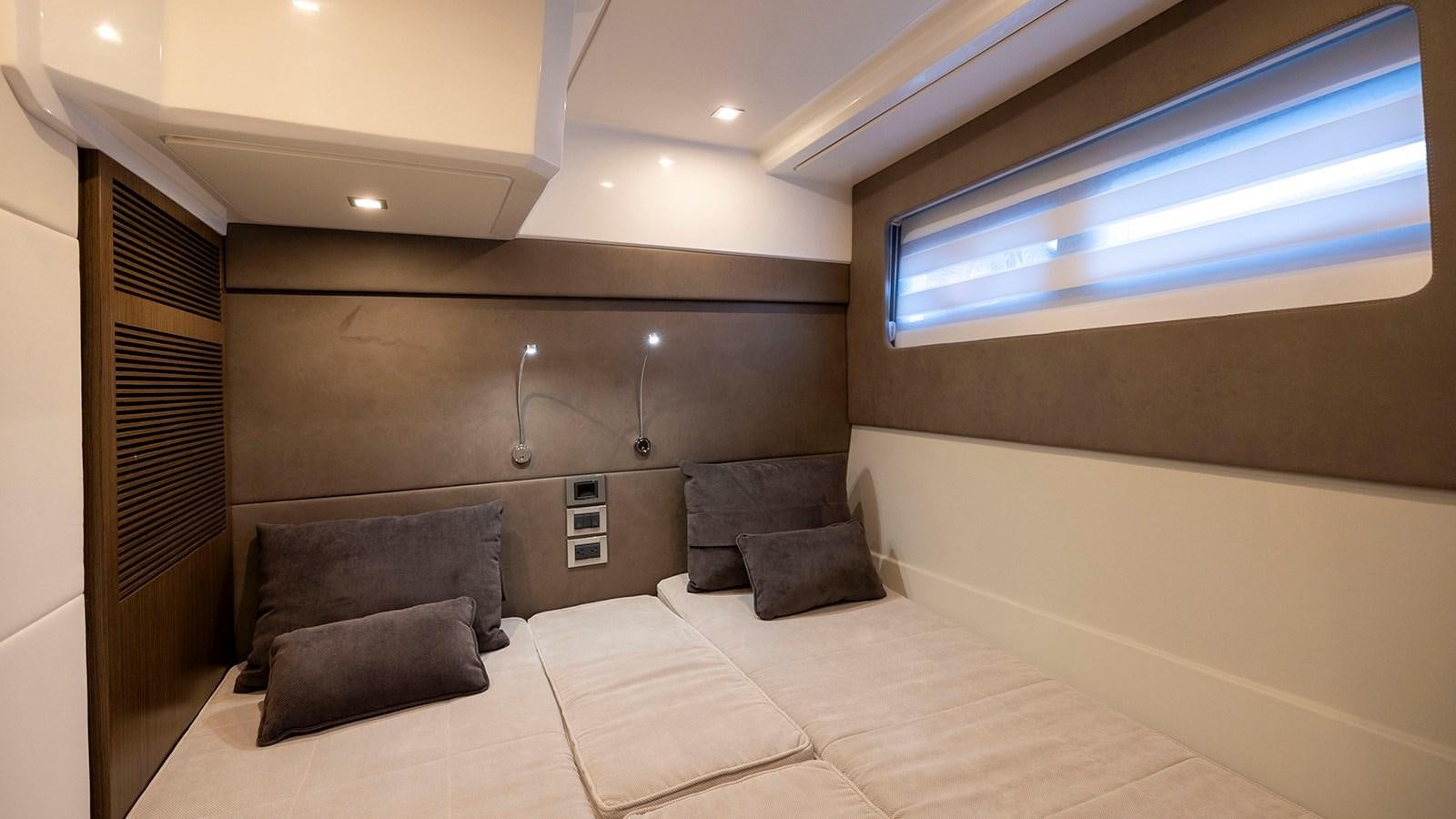 a bed in a room aboard MON TON Yacht for Sale