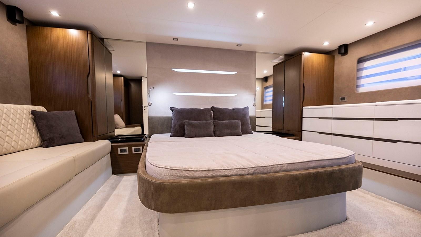 a large bed in a room aboard MON TON Yacht for Sale