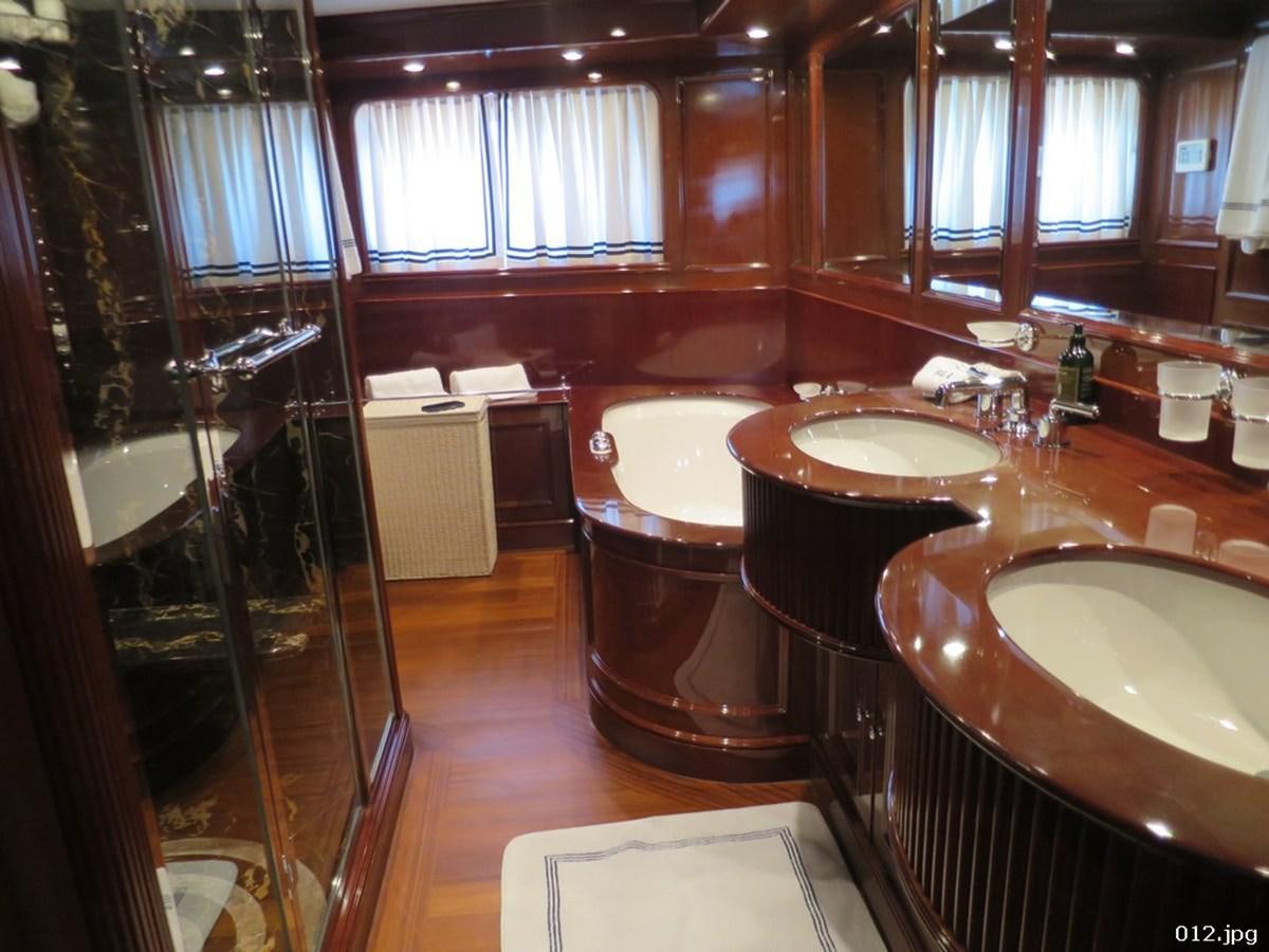 a bathroom with a tub sink and sinks aboard BLU Yacht for Sale